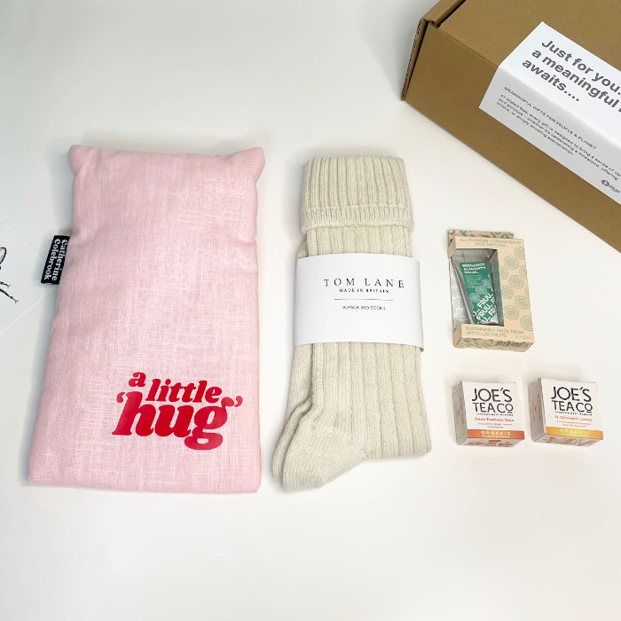 A 'little hug' water bottle with luxurious alpaca socks and a choice of Joe's Tea. A comforting, soothing and thoughtful gift